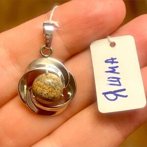 3 natural stones pendants. Metal is stainless steel.